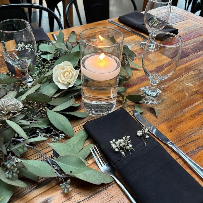 Place setting with eucalyptus and candle